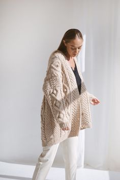 "Whatever stage in your life you may be - time always seems to pass by so quickly. We designed this oversize alpaca cardigan for the moments you wish time would stop. After all, what's most important is the laughter of a loved one, the feeling of the sea breeze on your cheek, and the warmth of a chunky wool cardigan. Embrace yourself with the softest knit, which is handmade from all-natural materials. DETAILS 65% Wool, 35% Alpaca wool. Light Beige color. You can choose any other color listed in Beige Cardigan Outfit, Uni Fits, Embrace Yourself, Chunky Cable Knit Cardigan, Trip Outfit, Cardigan With Buttons, Sweater Handmade, Leaves Falling, Irish Women