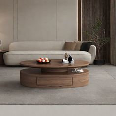 a living room filled with furniture and a white couch next to a coffee table on top of a hard wood floor