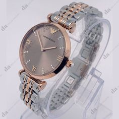 Sale! Last One!Emporio Armani Two Tone Rose Gold Stainless Steel Women's Watch - Band New With Tags! - Limited Quanity -100% Authentic - Full Retail Package With All Accesories About The Watch: Case Size: 31 Mm Case Thickness: 7.5 Mm Band Material: Stainless Steel Band Color: Two-Tone Band Width: 14 Mm Water Resistance: 30 Meters / 100 Fee