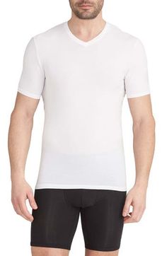 Silky, stretchy and ridiculously comfortable, these undershirts resist pilling and bunching around the collar and sport a longer length to stay tucked in. 28" length (size Medium) Pack of two undershirts V-neck Short sleeves 90% Tencel® modal, 10% Lycra® spandex Tencel modal is a sustainably produced fiber made with closed-loop processing and is certified with the EU Ecolabel as having a low environmental impact throughout the entire lifecycle Machine wash, tumble dry Imported White V-neck Top With Seamless Collar, Stretch V-neck T-shirt For Layering, V-neck Stretch T-shirt For Layering, White Moisture-wicking V-neck Tops, Fitted V-neck Moisture-wicking T-shirt, Fitted V-neck T-shirt For Sports, Tommy John, Kids Branding, Environmental Impact