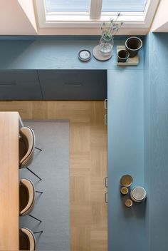 an overhead view of a kitchen with blue walls