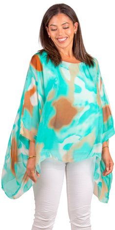 100% Silk Kaftan Style Blouse with Colorful Aura Print. Features 3/4 Length Sleeves and a Wavy Bottom. Exterior: 100% Silk Interior: 95% Viscose, 5% Elastic Fits Sizes XS- XL Made in Italy Multicolor Half Sleeve Tops For Beach, Green Half Sleeve Tops For The Beach, Bohemian Half Sleeve Blouse For Beach, Green Half Sleeve Tops For Vacation, Green Half-sleeve Top For Vacation, Green Half Sleeve Top For Vacation, Bohemian Half Sleeve Beach Blouse, Multicolor Half Sleeve Blouse For Summer, Summer Beach Blouse With Half Sleeves