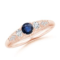 an oval blue sapphire and diamond ring in rose gold