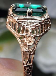 Natural Green Emerald 10k or 14k Rose Gold RingLovely Rectangle Design#D148 Make heads turn and stand out with this gorgeous piece of jewelry! This Edwardian reproduction filigree ring is made from rose gold and features an emerald cut high quality natural emerald gemstone measuring 9mm by 7mm. From the beautiful intricate floral daisy design to the inside of the band marked 10K or 14K for gold – this ring will take your look to the next level! Look no further than this exquisite vintage-inspire Luxury Rose Gold 14k Gold Emerald Ring, 14k Gold Emerald Cut Art Deco Jewelry, 14k Gold Art Deco Emerald Cut Jewelry, Elegant 14k Rose Gold Emerald Ring, Elegant Rose Gold Emerald Ring In 14k, 14k Gold Emerald Cut Art Deco Ring, 14k Rose Gold Emerald Ring, Elegant Rose Gold Emerald-cut Emerald Ring, Elegant Rose Gold Emerald Cut Emerald Ring