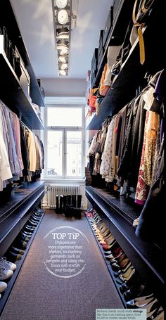 a walk in closet filled with lots of clothes