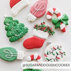 decorated christmas cookies are arranged on a white surface with the words sugar and dough written below