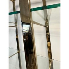 the reflection of a person walking through a mirror in a room with mirrors on the wall