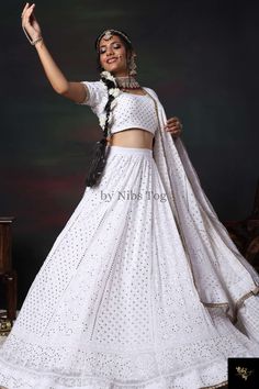 Handmade White Chikankari Lehenga - Bridal & Party Wear This exquisite hand-embroidered Chikankari lehenga in a White shade is perfect for bridal wear, bridesmaids, or a wedding guest. Embellished with golden mukaish work, it radiates elegance and grace, making it a stunning choice for any festive occasion. ✨ Product Features: Colour: White with golden mukaish embellishments Embroidery: Same-colour thread hand embroidery on lehenga, blouse, and dupatta Fabric: Pure viscose georgette (lightweight Chikankari Embroidery Gown For Reception And Festivals, Chikankari Embroidered Gown For Reception And Festivals, Festival Gown With Chikankari Embroidery For Reception, White Cutdana Gown For Festivals, Festivals Gown With Chikankari Embroidery For Reception, White Chikankari Embroidery Gown For Party, Party Sharara With Chikankari Embroidery For Navratri, Navratri Party Sharara With Chikankari Embroidery, Floor-length Choli With Chikankari Embroidery For Festive Occasions