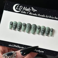 Welcome to LD Nails! 🖤 One set of 10 REUSABLE Press On Nails 🖤 🖤 Made to order in your shape & size 🖤 Sage Mandala: Pretty In Sage base with mandala designs and nail gems. Purchase INCLUDES an application kit! It consists of: 🖤 detailed application & removal instructions 🖤 a sealed and sanitary mani kit (100/180 file, buffer block, cuticle pusher) 🖤 2 alcohol pads 🖤 nail tabs or glue (glue is standard, request tabs in the personalization box if you prefer them!) *Only one kit is sent per order. Extra kits and kit contents can be picked up here 👉 https://www.etsy.com/ca/listing/817160463/application-kit-press-on-nails-gothic Est. 2020: LD Nails specializes in custom Gothic, Witchy and Alternative Press On Nails. I draw inspiration from what I love, so you’ll find heavy gothic influ Nails Gothic, Mandala Nails, Alcohol Pads, Nail Gems, Country Nails, Mandala Designs, Gel Press, Gem Nails, Cuticle Pusher