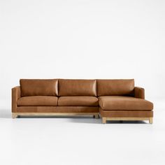 Long, low and made for lounging, our Pacific leather sectional complements contemporary living rooms with its easy, breezy style and the luxury of full-grain leather. Sustainably sourced wood with a light finish anchors the right-arm chaise and left-arm sofa with square legs and a full rail. Along with pillowy back cushions, the bull-nosed seats ensure a relaxing stay with medium-density, not-too-deep cushions. Rich and rustic leather upholstery takes the two-piece sectional sofa to the next lev Light Leather Couch, Tan Leather Sectional, Contemporary Living Rooms, Leather Chaise Sectional, L Sofas, Chaise Sectional Sofa, Breezy Style, Couch With Chaise, Sofa Review