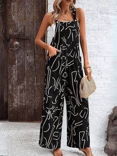 Unleash your inner wild side with our Funky Female Printed Wide Leg Jumpsuit in black! This playful and quirky outfit features a bold and unique print that is sure to turn heads. The wide leg design adds a touch of comfort and style, making it perfect for any occasion. Get ready to make a fashion statement with this must-have overalls! Size Guide: Model is 5’6” tall, and has a 33.2” bust, 26.4” waist, & 35.2” hips. She is wearing a S / US 4 / AU 8. This jumpsuit is true to size. Material: 100% Viscose. Feature: Side pockets. Square Neckline. Viscose Breathable Fabrication. Shoulder Tie. Wide Leg. Maternity Friendly. Care Instructions: Machine wash / Cold hand wash Black Printed Sleeveless Jumpsuits And Rompers, Black Sleeveless Printed Jumpsuits And Rompers, Trendy Black Printed Jumpsuits And Rompers, Chic Black Printed Jumpsuits And Rompers, Black Beach Overalls And Rompers, Casual Graphic Print Jumpsuits And Rompers For Summer, Casual Summer Jumpsuits And Rompers With Graphic Print, Black Overalls Jumpsuit For Vacation, Black Overall Jumpsuit For Vacation