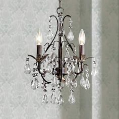 a chandelier hanging from the ceiling in a room