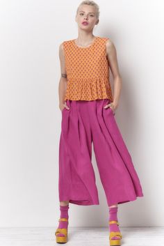 The Trudy pant is high waisted cropped pant. There are 2 button tabs on the front waist and stitched elastic on the back waist. Shown here in our Dyed Linen. Content: 100% Linen Color: Fuchsia Fits: Fitted waist with a full leg Sizes: XS-L What we Love: Great styling and fit Made In Los Angeles with Love Model is 5'9" size 2 and is wearing a size S *Mask sold separately Measurements are taken relaxed, take your normal size Cropped Cotton Bottoms With Belt Loops, Cropped Pants With Pockets For Spring, Casual Cropped Bottoms With Belt Loops, Cropped Wide Leg Pants With Pockets, Spring Cropped Bottoms With Belt Loops, Cropped Pants With Belt Loops For Spring, Spring Cropped Pants With Relaxed Fit, Cropped Bottoms With Elastic Waistband For Summer, Spring Cropped Bottoms With Elastic Waistband