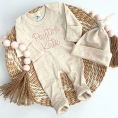 ✿ Welcome to our shop ✿ Our goal is to bring you the cutest and trendiest designs on the highest quality sweatshirts and shirts. All of our products are designed, embroidered printed, pressed, and shipped from our NJ studio. This adorable sleeper makes a perfect coming home outfit, newborn pictures, or baby shower gift. This features an ultra soft romper, with stitched name. Matching hat that will come with matching stitching. This outfit makes a perfect coming home outfit, newborn pictures, or Fitted Organic Cotton Long Sleeve Onesie, Fitted Long Sleeve Organic Cotton Onesie, Pink Cotton Onesie With Letter Print, Pink Cotton Onesie For Gift, Pink Cotton Onesie As A Gift, Pink Cotton Onesie With Name Print, Cotton Onesie With Name Print, Pink Cotton Onesie As Gift, Customizable Cotton Onesie