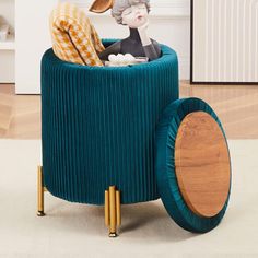 a toy rabbit sitting on top of a blue chair