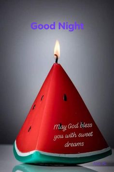 a watermelon slice with a candle on it saying good night may god bless you with sweet dreams