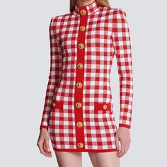 The Abby Long Sleeve Gingham Print Button Embellished Mini Dress is a charming and stylish ensemble that exudes retro-inspired flair with a modern twist. Featuring a classic gingham print adorned with button embellishments, this mini dress offers a playful yet sophisticated look suitable for various occasions. 1. Gingham Print: The gingham print adds a touch of vintage charm and timeless appeal to the dress. This classic pattern is versatile and never goes out of style, making it perfect for both casual and semi-formal settings. 2. Button Embellishments: The button embellishments along the front of the dress add visual interest and a hint of retro flair. These decorative buttons serve as both functional and decorative elements, enhancing the overall design of the dress. 3. Long Sleeve Desi Embellished Mini Dress, Button Embellishments, Glamorous Party, Loose Maxi Dress, Linen Shirt Dress, Shirt Dress Casual, Cami Crop Top, Decorative Elements, Decorative Buttons