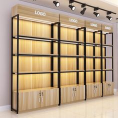 an empty store with wooden shelves and lights