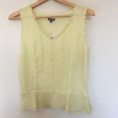 Beautiful Sunshine Yellow Ann Taylor 100% Silk Peplum Blouse, New With Tags Still Attached. Beautiful Frilly Trim And Fully Lined Blouse With A Very Flatering Tailored Fit, And Hidden Side Zipper To Slip Into. Originally Retails For 69.00, One Small Hole On Second Side Of Double Lining On Bottom, Which Means Won't Ever Be Seen When Wearing But Wanted To Disclose As Pictured. Pit To Pit: 17 In. Pit To Hem: 12.5 In. Elegant Yellow Summer Blouse, Silk Tops For Summer Daywear, Silk Ruffle Top For Daywear, Elegant Yellow Tops For Summer, Elegant Yellow Summer Tops, Yellow Sleeveless Silk Top, Elegant Yellow Sleeveless Blouse, Elegant Sleeveless Yellow Blouse, Elegant Yellow Tops For Daywear