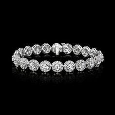 Dazzling Round Diamond Bracelet With 17 Jewels, Dazzling Round Platinum Diamond Bracelet, Dazzling Platinum Diamond Bracelet, Round Diamond Bracelet With Halo Design, Diamond Bracelet With Halo Design, Diamond Halo Bracelet, Formal Diamond Bracelet With Halo Design, White Gold Diamond Bracelet With Halo Design, Diamond Bracelet With Halo Design In White Gold