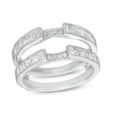 a white gold ring set with princess cut diamonds