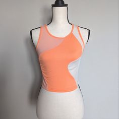 Light And Bright Orange And Orange Abstract Color Block Cropped Ribbed Tank Top Size M Has Great Stretch 95% Polyester 5% Spandex 15.5" Pit To Pit | 16" Long Spring Mesh Tops With Built-in Bra, Orange Sleeveless Athleisure Top, Orange Sleeveless Top For Athleisure, Pink Fitted Mesh Top, Fitted Pink Mesh Top, Summer Mesh Top With Built-in Bra, Spring Mesh Fitted Tank Top, Orange Sleeveless Top For Workout, Orange Sleeveless Workout Tops