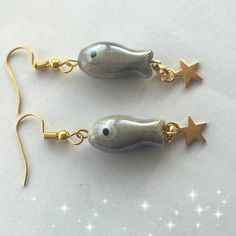 Japanese mini grey koi fish earrings. Cute ceramic bead koi fish carp star earrings. The koi fish has long been known as a lucky symbol of good fortune.  These earrings feature a unique design that is my own design making them a one-of-a-kind gift for your loved ones. The cute ceramic fish on the earrings are seen swimming upstream against the current, symbolizing perseverance and strength. The earrings also come with gold or silver plated hooks that add a touch of elegance to the design. Measur Japanese Koi Fish, Fish Symbol, Fish Earrings, Lucky Symbols, Intense Love, Money Success, Japanese Koi, Fun Clothes, Ceramic Fish