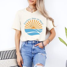 Embrace the laid-back vibes with our "Sunshine State of Mind" t-shirt! Featuring a beautiful illustration of a sunset over the ocean, this shirt is perfect for beach lovers and dreamers. Made from soft, high-quality fabric, it's comfortable for all your summer adventures. Capture the essence of sunshine and serenity with this stylish and uplifting tee! This classic unisex jersey short sleeve tee fits like a well-loved favorite. Soft cotton and quality print make users fall in love with it over a Relaxed Summer T-shirt For Everyday, Custom Print Summer Tops For Everyday, Custom Print Summer Top For Everyday, Custom Print Tops For Everyday Summer Wear, Custom Print Top For Everyday Summer Wear, Casual Graphic Print T-shirt For Warm Weather, Casual Short Sleeve T-shirt For Summer, Relaxed Fit Summer T-shirt, Casual Relaxed Fit T-shirt For Summer