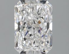 a cushion cut diamond on a gray background