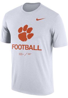 a white shirt with an orange and black logo on the front, which reads football