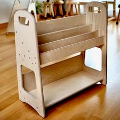 a wooden shelf sitting on top of a hard wood floor