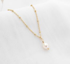 "Classic Real Freshwater Pearl Necklace in 14k gold filled chain. Perfect for your wedding jewelry or makes great bridesmaid gifts. Your wife will love it as an anniversary or birthday gift. This timeless pearl necklace is perfect for everyday wear or layering.  N E C K L A C E - D E T A I L S: * Freshwater Pearl - 8-9mm * 14k Gold Filled Chain   -Satellite Chain   -Paperclip chain   -Figaro Chain   -Cable Chain * 14k gold Filled Spring Ring Clasp and Findings * All raw materials are sourced fro 14k Gold Delicate Chain Pearl Necklace For Weddings, Elegant Birthstone Jewelry For Wedding Gift, 14k Gold Filled Yellow Gold Jewelry For Bridesmaid Gift, Dainty 14k Gold Jewelry For Bridesmaid Gift, Delicate Yellow Gold Jewelry For Bridesmaid Gift, 14k Gold-filled Round Pendant Necklace For Wedding, 14k Gold Filled Pearl Pendant Wedding Jewelry, Gold Pearl Pendant Jewelry For Bridesmaid Gift, 14k Gold Filled Pearl Pendant Jewelry For Wedding