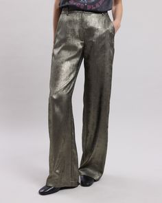 Women's wide, flowing lamé pants. High waist, flat belt with loops and zipper. Two Italian pockets on the sides. Shiny Pants For Workwear, Party Pants In Metallic Color With Sheen, Metallic Sheen Pants For Party, Metallic Party Pants With Sheen, Luxury Long Pants For Night Out, Luxury Gold Formal Bottoms, Glamorous Gold Bottoms For Fall, Glamorous Gold Evening Pants, Luxury Gold Party Bottoms