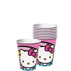 hello kitty paper cups are stacked on top of each other in front of a white background