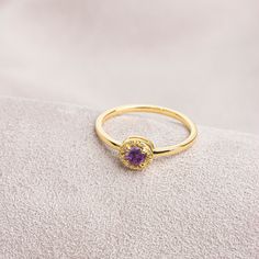 The color of amethyst can vary from light lilac to bright purple. It represents calmness. It is a crystal that you can always wear and is compatible with other stones. Our round cut ring with Amethyst stones surrounded by real diamonds is produced to always be with you. It can be given as a gift to yourself, your friends, your lover or your mother. Crown your happy days with our ring. We hope you create beautiful memories with our ring.   Amethyst is the birthstone for those born in February. Yo 14k Gold Purple Amethyst Ring With Bezel Setting, Purple 14k Gold Amethyst Bezel Setting Ring, Yellow Gold Amethyst Ring With Halo Setting For Promise, Gold Amethyst Ring Gift, Gold Amethyst Ring For Gift, Gold Amethyst Ring With Round Cut For Gift, Gold Amethyst Ring Round Cut For Gift, Gold Amethyst Birthstone Ring Round Cut, Gold Amethyst Ring With Halo Setting