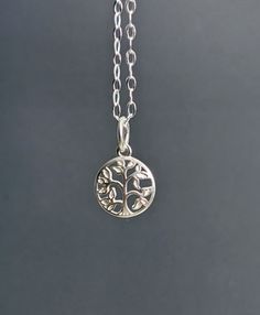 "Tree of Life Symbol, Silver Filigree Leaf Charm Necklace, Simple Sterling Silver Chain, Minimalist, Wedding Jewelry, Gift for Her. The pendantis approx: 12 mm. Necklace - 16\" in length. * Processing time is 3 - 5 days.  * US orders are shipped first class mail. * International orders are shipped first class international. * Shipping upgrades are available at checkout. Thank you for visiting my listing! Have a wonderful day!" Delicate Silver Charm Necklaces For Bridesmaids, Delicate Nickel-free Charm Necklace For Anniversary, Simple Nickel-free Wedding Jewelry, Nature-inspired Sterling Silver Wedding Necklaces, Silver Charm Necklaces For Wedding, Tiny Silver Necklace For Anniversary, Nature-inspired Sterling Silver Necklace For Weddings, Silver Round Charm Necklaces For Wedding, Nature-inspired Sterling Silver Wedding Necklace