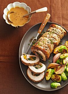 a plate with sliced meat, brussel sprouts and brussels sprouts