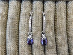 "Amethyst hoop earrings 1 1/8\" in diameter, cast and antiqued in sterling silver 925 with lever type ear wires, it has 8mm by 12mm amethyst briolettes, capped in sterling silver...from the ear wire to the end of the briolette it is 1 3/4\" total...well made earrings" Nickel-free Purple Dangle Hoop Earrings, Purple Nickel-free Dangle Hoop Earrings, Adjustable Purple Jewelry With Lever Back Ear Wires, Sterling Silver Jewelry With Purple Sterling Silver Clasp, Purple Sterling Silver Jewelry With Silver Clasp, Purple Sterling Silver Jewelry With Sterling Silver Clasp, Adjustable Nickel-free Purple Hoop Earrings, Elegant Small Hoop Purple Earrings, Elegant Purple Small Hoop Earrings