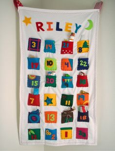 a wall hanging with numbers and letters on it