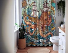 a bathroom with an octopus and ship shower curtain