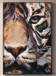 a painting of a tiger's face on a wall