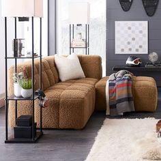 a living room with two couches and a rug on the floor in front of it