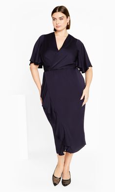 The Soft Ruffle Dress brings a refreshing style with a charmingly chic style. Designed with feature ruffle detail, a deep faux wrap pleat V neckline and textured sateen feel stretch, this dress is destined to turn heads. Key Features Include: - Deep faux wrap pleat V-neckline - Short flutter sleeves - Elasticated back waistband - Faux wrap drape skirt - Feature ruffle detail - Pull over style - Textured sateen feel stretch fabrication - Satin lined Love this piece with a pair of emerald-hued hee V-neck Midi Dress With Ruffles For Formal Occasions, Party Dress With Faux Wrap And Short Sleeves, Elegant Spring Wrap Dress With Ruffle Hem, Elegant Wrap Dress With Ruffle Hem For Brunch, Evening Wrap Dress With Ruffles And Surplice Neckline, Elegant V-neck Ruffle Dress For Evening, Surplice Neckline Ruffle Wrap Dress For Party, Surplice Neckline Wrap Dress With Ruffles For Party, Party Wrap Dress With Ruffles And Surplice Neckline