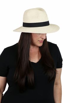 Get your hat-i-tude on with this classic wide brim fedora hat for women. Soft, comfy, crushable and packable with a 50+ UPF sun protection factor. A great summer travel hat with a sophisticated look. Scroll down for video! 3.5 inch brim in front shades your eyes and provides ample sun protection without being overpowering. Tapers slightly to 3 inches in the back to clear your collar and headrest while driving. 50+ UPF sun protection factor. Only 1/50th of the sun's UV radiation can penetrate thi Summer Fedora With Short Brim For Everyday, Lightweight Flat Brim Sun Hat, Lightweight Sun Hat With Flat Brim, Lightweight Solid Color Sun Hat With Flat Brim, Summer Fedora With Curved Brim For Everyday, Casual Curved Brim Hat With Upf 50+, Casual Hats With Upf 50+ And Curved Brim, Classic Lightweight Sun Hat For Outdoor, Solid Brimmed Panama Hat For Travel