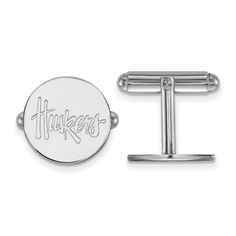 Show your school spirit with this pair of University of Nebraska cuff links. They are created from Rhodium Plated Sterling Silver and measures 15 millimeters in length. We are a certified Collegiate jewelry retailer and this authentic item is officially licensed. It is crafted in the USA. Nebraska Huskers, Nebraska Cornhuskers, Sterling Silver Cufflinks, Bow Jewelry, Hoop Earring Sets, Lasercut Design, Jewelry Pins, Silver Cufflinks, Sterling Silver Mens