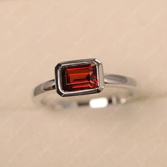 Garnet Ring, Emerald Cut, Stelring Silver, January Birthstone, Solitaire Engagement Ring, East West Ring - Etsy Engagement Ring East West, East West Ring, Ring Emerald Cut, Memorial Ring, Garnet Gem, London Blue Topaz Ring, Ring Emerald, Twist Ring, January Birthstone