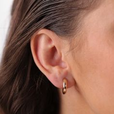 Add a touch of sophistication to your daily style with the Goldens Hoops earrings. Crafted from 14K gold, these medium-sized hoops are perfect for everyday wear. Their timeless and classic golden glow makes them versatile to any jewelry collection. Gold Diamond Hoop Earrings, Golden Hoops, Hoop Earrings Gold, Hoops Earrings, Golden Glow, Eternity Band Ring, Diamond Hoop Earrings, Daily Style, Sandals For Sale