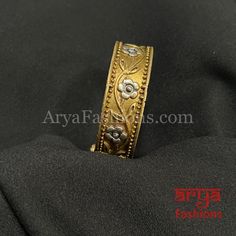 Dual Tone Golden Silver Rajwadi Openable Bracelet- Dual Tone Oxidized Silver Bracelet- Very Elegant and stylish, this bracelet can be paired with any Attire depending upon the occasion and the theme.- The base is pure brass (90%) and pure 92.5 silver (10%) which makes this very sturdy and of good quality.- 100% guarantee on the polish- it will not lose its finish/color/shine.- Very lightweight and Hand carved. - Available in size 2.4 and 2.6. - Openable Bracelet with screw closing feature Adjustable Traditional Gold Bangle Bracelet, Traditional Adjustable Gold Bracelet As A Gift, Traditional Adjustable Gold Bracelet Gift, Traditional Adjustable Gold Bracelet For Gift, Traditional Band Jewelry As Gift, Traditional Adjustable Band Jewelry, Traditional Bangle Wristband As Gift, Oxidized Bangles, Oxidized Silver Bracelet