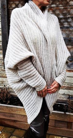 "Handmade cardigan. Pure merino wool. Loose fitting. Wear it with anything from jeans to a maxi dress. Woman in photo wearing \"light natural color\" cardigan. Wool's unique advantage is its breathability. That is it's ability to absorb and release moisture from the surrounding air, without compromising it's thermal efficiency. Wool does not support combustion and will extinguish itself in the event of fire Wool is natural, renewable and sustainable Such cardigan can be worn by people of every a White Merino Wool Cardigan For Fall, Cozy Merino Wool Cable Knit Cardigan, Merino Wool Cable Knit Cardigan For Layering, Oversized Merino Wool Knit Cardigan, Chunky Knit Merino Wool Cardigan For Layering, Soft Knit Merino Wool Cardigan, Cozy Knit Cardigan For Layering, Cozy Cashmere Knit Cardigan, Cozy Beige Merino Wool Cardigan