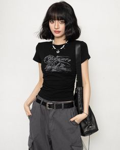 A short sleeve T-shirt perfect for Y2K fashion.

The slightly tight silhouette that fits the body gives it a feminine look.

Recommended for those who want to wear it compactly or are looking for tops with a slim silhouette.
◾️Model
Height/Weight：160cm(62.9in)/44kg(97.lb)
Fitting Size：S
◾️Material
cotton　93.8%
spandex　6.2%



Size (cm)
Length
Shoulder
Chest
Sleeve Length


S
44
32
66
12


M
46
34
70
13


L
48
35
74
14 Y2k Style Fitted Short Sleeve T-shirt, Y2k Style Stretch Short Sleeve T-shirt, Fitted Black Grunge T-shirt, Black Stretch Grunge T-shirt, Grunge Style Stretch Short Sleeve T-shirt, Edgy Stretch Short Sleeve T-shirt, Edgy Fitted Crew Neck T-shirt, Edgy Short Sleeve Stretch T-shirt, Punk Stretch T-shirt For Streetwear